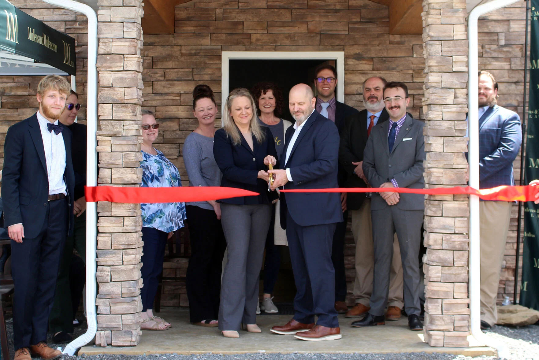 Mullens & Mullens PLLC Partners cut ribbon
